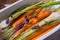 Young carrots and spring onions prepared for baking