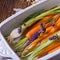 Young carrots and spring onions prepared for baking