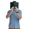 Young casual man covering his face with a book