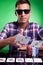 Young casual poker player throwing a pair of aces