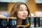 Young casual woman picking groceries in a supermarket