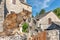 Young cat resting in the morning sun in a stone village