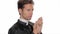 Young catholic priest saying a prayer