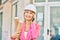 Young caucasian architect woman smiling happy using smartphone at the city