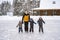 Young caucasian bearded man teach boys how to skate. Father`s day concept. cute caucasian boys learning to skate.