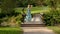 Young Caucasian Blonde Woman Walk In Park.