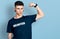 Young caucasian boy with ears dilation wearing volunteer t shirt strong person showing arm muscle, confident and proud of power