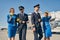 Young Caucasian cabin crew dressed in stylish uniforms