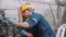 Young caucasian engineer man operating lathe machine for preparing production at factory industrial.