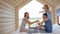 Young Caucasian family couple with baby daughter in a small modern rustic house with a large window. Lying on the bed