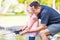 Young Caucasian Father and Daughter Having Fun Fishing At The La