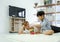 Young caucasian father and his adopted son enjoy playing wooden blocks toy in the living room during the holidays. Work life