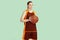 Young caucasian female basketball player against mint colored studio background