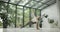 young caucasian fitness woman practicing yoga on a yoga mat in a modern studio with plants and large forest or garden