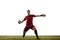 Young caucasian football player, male soccer goalkeeper wearing red football kit isolated over white background. Sport