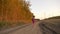 Young caucasian girl running jumping by country road. White blonde long hair girl jumping outdoors.