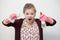 Young caucasian girl woman with rubber gloves, sponge and sprayer, cleaning the house