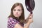 Young caucasian girl woman threaten to hit with frying pan. Angry, defensive or aggressive