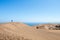 Young caucasian male traveler trekking at Concon sand dune in Vina del Mar, Chile