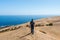 Young caucasian male traveler trekking at Concon sand dune in Vina del Mar, Chile