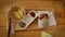 Young caucasian man dipping nachos in sauce while eating Mexican food. Top close up view