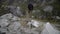 young caucasian man hiking through a mountainous landscape