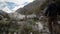 young caucasian man hiking through a mountainous landscape