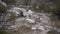 young caucasian man hiking through a mountainous landscape