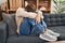 Young caucasian man patient stressed sitting on sofa at psychology clinic