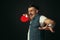 Young caucasian man playing tennis isolated on black studio background in retro style, action and motion concept