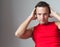 Young Caucasian man in red sporty shirt