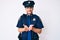 Young caucasian man wearing police uniform smiling with hands palms together receiving or giving gesture