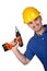 Young caucasian manual worker with drill
