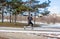 Young caucasian runner man training in winter park