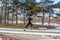Young caucasian runner man training in winter park
