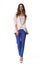 Young caucasian student girl full body photo walking in blue trousers and white summer jacket