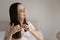 Young Caucasian woman brush healthy long hair