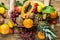 Young caucasian woman holds in hands box with raw organic tropical and seasonal summer fruits berries. Halved papaya coconut mango