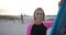 Young Caucasian woman holds a surfboard on the beach, with copy space