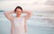 Young Caucasian woman on ocean coast