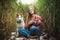 Young caucasian woman playing ukulele with husky