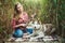 Young caucasian woman playing ukulele with husky