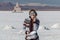 Young caucasian woman portrait. Female traveling girl happy and smiling in white salt flat Uyuni, Bolivia