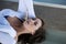 Young caucasian woman reclining on picnic table