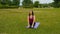 Young caucasian woman relaxing by practicing yoga at outdoor place in the morning. Beautiful woman doing yoga in the