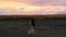 Young caucasian woman stand in nature alone thoughtful watch sunset on beautiful location outdoors search purpose in life concept