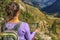 Young caucasian woman in the top of the mountain doing yoga and meditation in the Swiss Alps. Travel and sport concept