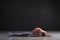 Young caucasian woman on a yoga mat doing fish pose.