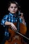 Young Cellist playing classical music on cello