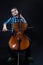 Young Cellist playing classical music on cello